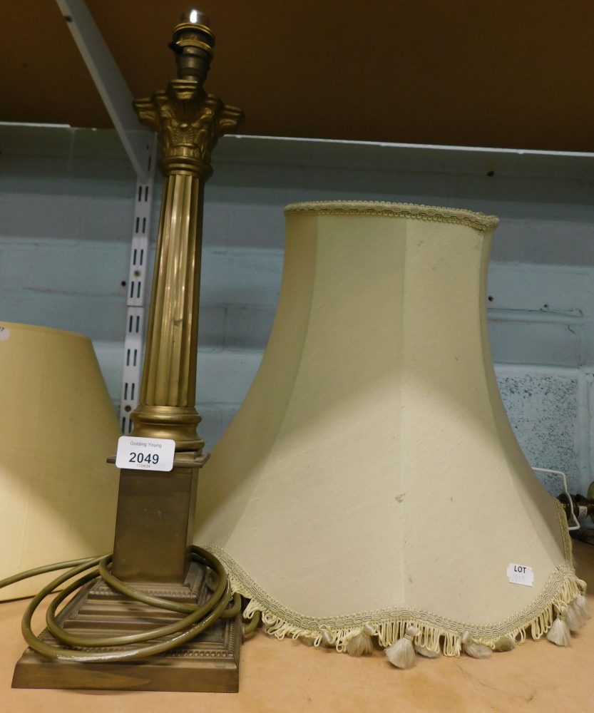 A 20thC brass columned table lamp, the Corinthian column on a square reeded base, 47cm high.