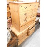 A pair of pine three drawer bedsides, 54cm high, 48cm wide, 42cm deep, and a pine chest of four draw