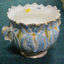 A cream finish planter, with blue painted floral decoration.