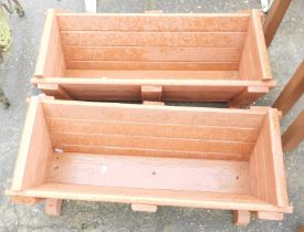 A pair of painted wooden garden troughs, 27cm high, 72cm wide, 35cm deep.