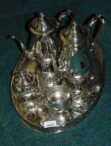 A silver plated oval serving tray, and a four piece Oneida silver plated tea and coffee service.