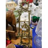 Two brass ornate tabletop picture frames. (2)
