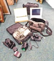 Two cased computers and some camera equipment, enclosed in two bags, comprising Canon camera, Compaq