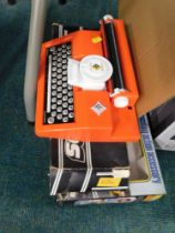 Scalextric auto start accessory kit, a Scalextric Skid Chicago kit and a Casdon type writer.