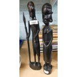 Two tribal art figures, comprising warrior and spear, and another on oval base, 36cm high. (2)