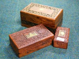 Three hardwood boxes, comprising one set with brass Taj Mahal, and two others. (3)