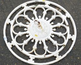 A wrought and cream painted wall bracket/ceiling rose.