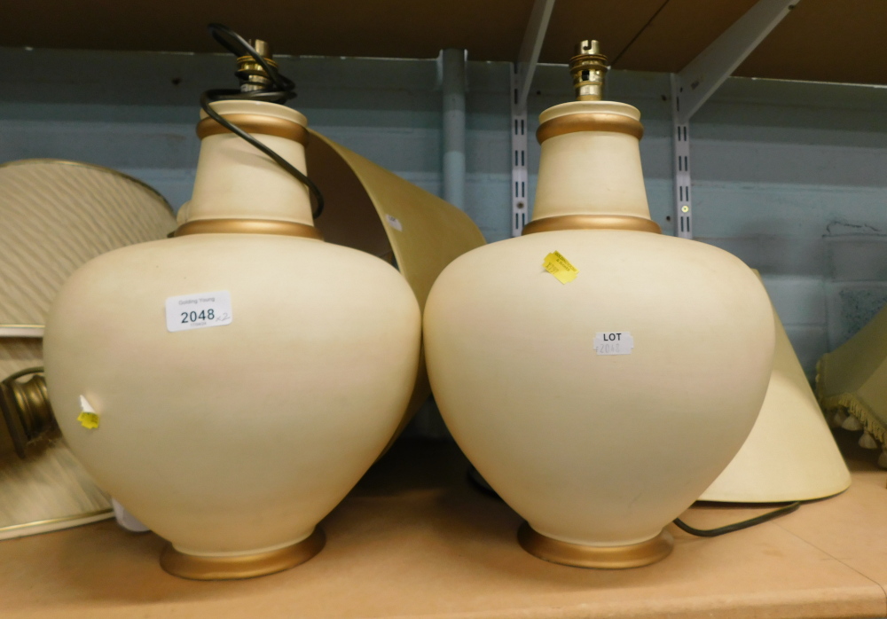 A pair of Readers cream and gold ceramic urn based table lamps, 39cm high, with shades.