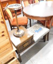 A mahogany telephone table, and a chrome ashtray. (2) The upholstery in this lot does not comply wit