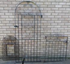 A cast metal garden gate, with arched top, and a wrought outdoor frame. (3)