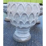 A reconstituted stone pineapple urn deep planter, pineapple pattern, on a circular base, 47cm high.