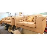 A terracotta sofa suite, comprising three seater sofa, two seater sofa, an armchair and scatter cush