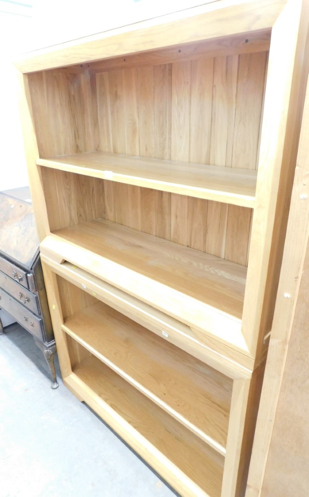 A pair of modern finish beech bookcases, 86cm high, 115cm wide, 38cm deep.