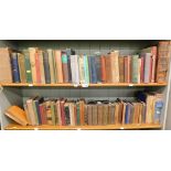 Hardback books, comprising poems, Robinson Crusoe, 19thC dictionary, and others. (2 shelves)