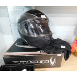 A Black Titan SV motorcycle helmet, model Titan SV, size 58 medium, with material slipcover, and Ric