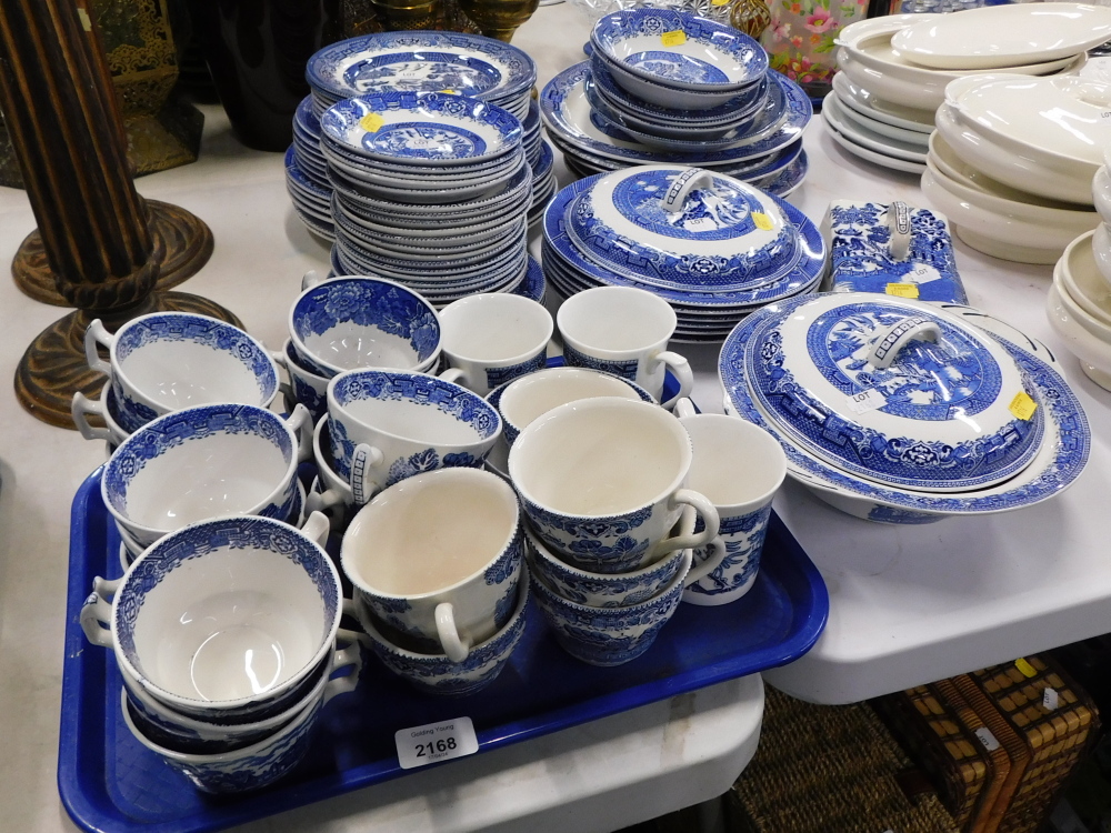 Blue and white china, comprising cups and saucers, tureens and covers, butter dish and cover, oval s