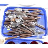 A part set of Thomas Cork and Sons of Sheffield wooden handled and stainless steel cutlery. (1 tray)