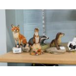 Animal figure groups, comprising an Arista designs otter, 10cm high, a Border Fine Arts fox on rock,