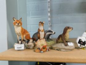 Animal figure groups, comprising an Arista designs otter, 10cm high, a Border Fine Arts fox on rock,