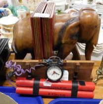 A pair of hardwood elephant bookends, and an imitation dynamite lamp.