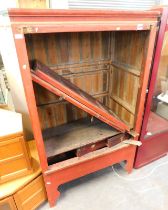 A Chinese red lacquer cabinet. (AF)