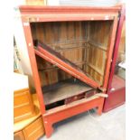 A Chinese red lacquer cabinet. (AF)