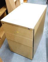 A Paragon three drawer filing cabinet, in simulated oak finish, 86cm high, 44cm wide, 62cm deep.