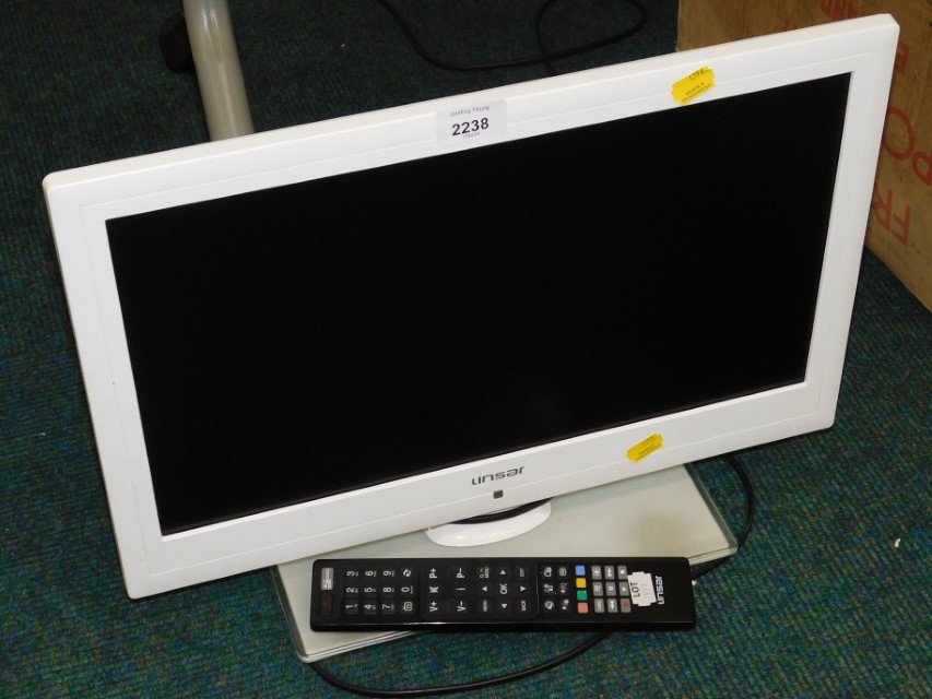 A Linsar 19" white framed television, with remote.