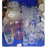 Glassware, comprising a pink 1950s glass lemonade jug and six beakers, drinking glasses, glass bell,