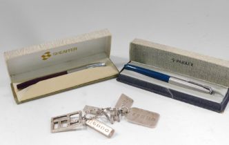 A Parker and Schaeffer ballpoint pen, and three various sized silver ingots.