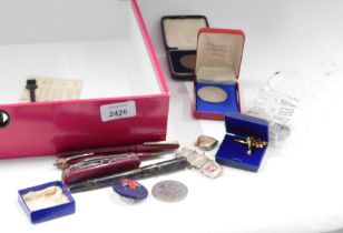 A Swiss Army knife, three ballpoint pens, Royal commemorative pin badges, silver plated coin bracele