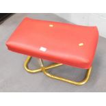 A retro stool, on red leatherette top, on gold finish base. The upholstery in this lot does not comp