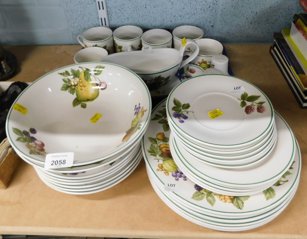 A fruit and flowered pattern part dinner service, to include dinner plates, cups and saucers, bowls,