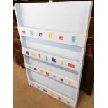 A pale blue painted pine wall rack, with alphabet front.