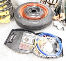 A space saver spare tyre and a snow chain set. (2)