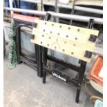 Two work benches, comprising a folding saw horse, a curtain chain, and a black metal work bench. (3)