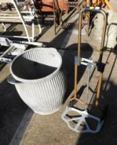 A galvanized dolly tub, with soap dish, 53cm high, and a pair of sack wheels.