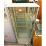 A shop display cabinet, with greyed doors and fitted shelf interior, 172cm high, 64cm wide, 33cm dee