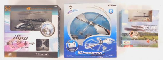 Three model helicopters, comprising Fly Tech Blade Star remote control copter, I Spy three channel r