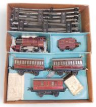 A Hornby O gauge number 501 clockwork train set, including 0-4-0 LMS locomotive, three coaches and t