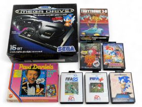 A Sega Megadrive and games, including Sonic Spinball, Sonic The Hedgehog, Fifa Soccer 95, Fifa Socce