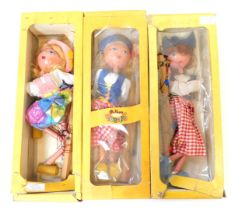 Three Pelham puppets, comprising Dutch Girl (x2) and Tyrolean Girl, boxed. (3)