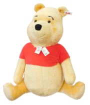A Steiff Winnie the Pooh studio bear, model 690600, with tag and labels, 82cm high.