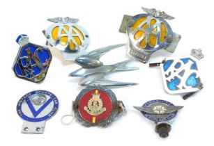 A collection of car badges, comprising two AA car badges, two RAC car badges, a Salvation Army J R G