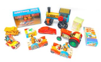 Various tinplate and other toys, comprising battery operated cartoon bike, Japanese tinplate wares,