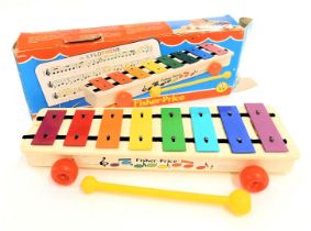A Fisher Price xylophone, boxed.