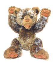 A Charlie Bears plush jointed brown Teddy bear, with laughing mouth, bearing label and spotted desig