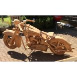 A teak Harley Davidson fat boy motorcycle full scale carving, 115cm high, 93cm wide, 220cm long.