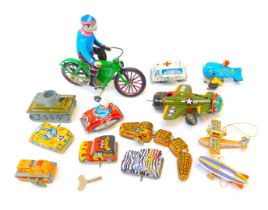 A group of Japanese and Chinese clockwork tinplate toys, to include aeroplane, man on bicycle, racin