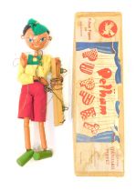 A Pelham puppet, modelled as a Pinocchio, boxed.